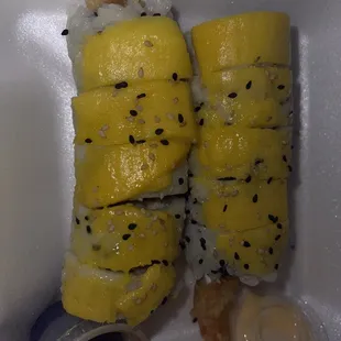 Ceviche Roll topped with mango