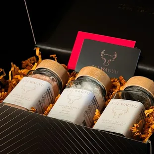 a black box containing four bottles of wine