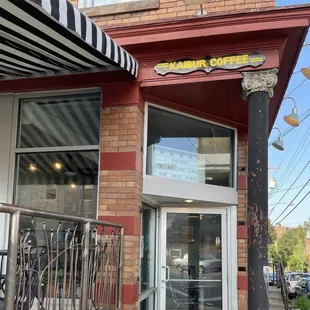 the entrance to a coffee shop