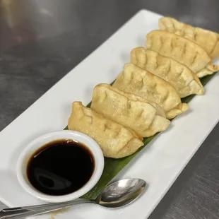 Potstickers served with ginger sauce
