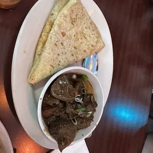 Curry lamb and dhal puri