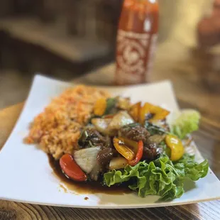 Filet mignon with red rice... I asked for a noodle dish. It was still tasty!