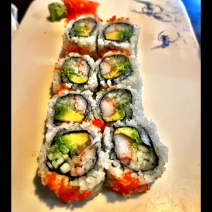 a plate of sushi rolls