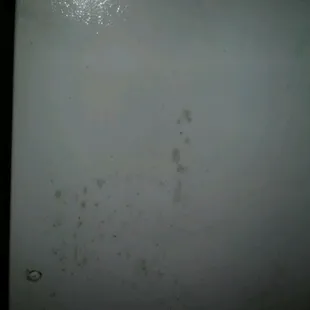 rust stains all over the front of the fridgerator