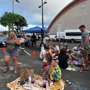  group of people sitting on the ground