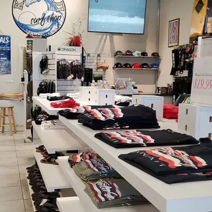 rows of t - shirts on display