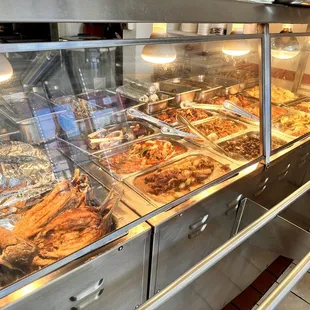 a variety of food in a display case