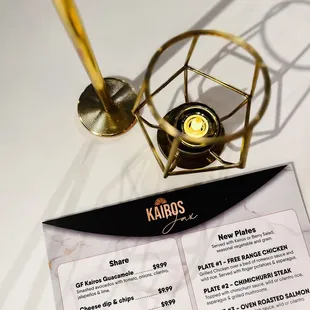 a menu and a candle holder