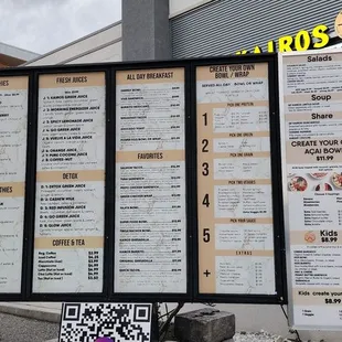 a menu board outside of a restaurant