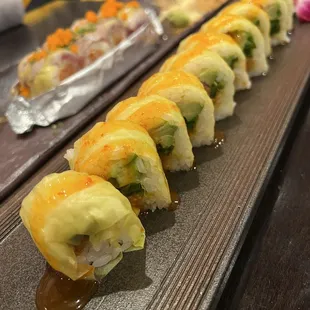 a row of sushi rolls