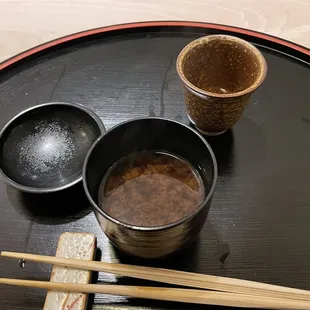 two cups of tea and chopsticks
