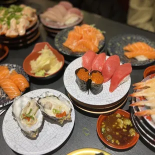 Salmon Sushi (sake), oyster, Sweet Shrimp Sushi, Tuna Sushi, ikura sushi