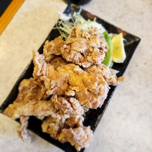 a plate of fried chicken on a table