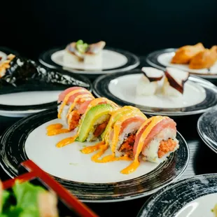 a variety of sushi on plates