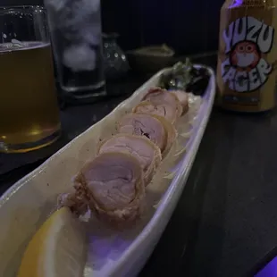 a plate of food and a can of beer