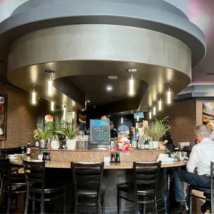 customers sitting at the bar