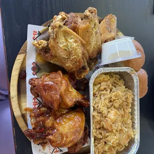 Sweet heat and lemon pepper wet wings with crab cake rice
