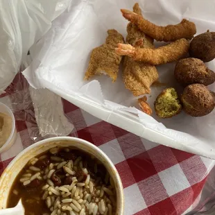 Watery red beans and rice, soft hush puppies, frozen seafood, small fish