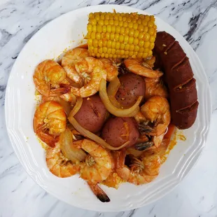 Boiled Shrimps, corns, potatoes, and sausages