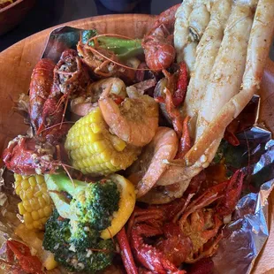 Crawfish, snow crab cluster, shrimp, boiled egg, potato, corn, broccoli