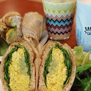 Chicken sandwich and a tuna melt with a matcha latte and cappucino