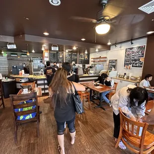 a group of people sitting at tables