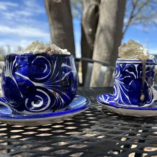two cups of coffee with whipped cream