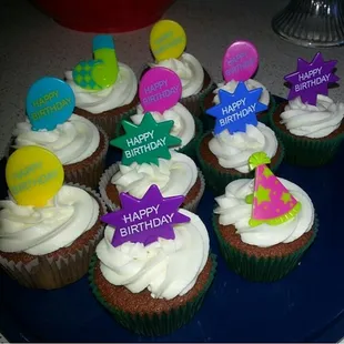 cupcakes decorated with happy birthday signs