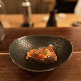 a plate of food on a wooden table