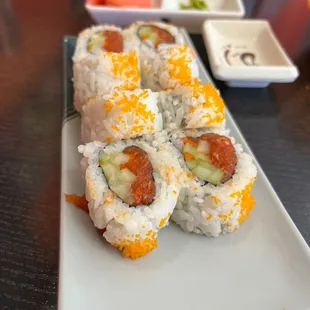 a plate of sushi rolls