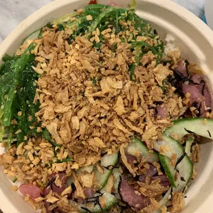 Tuna, brown rice, cucumber, crispy garlic, cucumber salad. Spicy mayo on the side. Incredible blend of flavor/texture w super fresh fish!