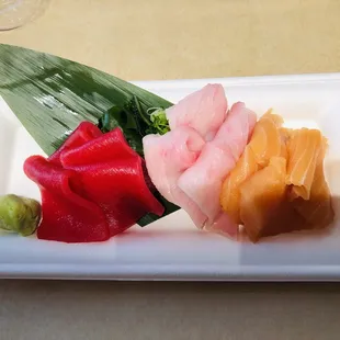 Yellowtail, tuna and salmon sashimi.