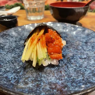 a plate of sushi on a table