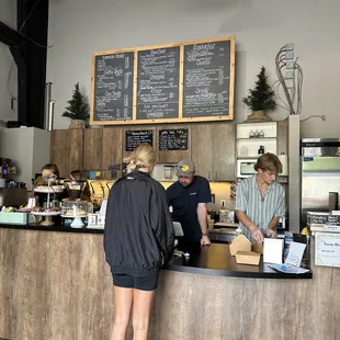 two people standing at the counter