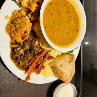 Sabhar (Lentil) Soup, Cauliflower Potato, Kofta, Chickpeas Curry, Carrots Pickle, Yellow Rice, Samosa, Boiled Carrot &amp; Broccoli