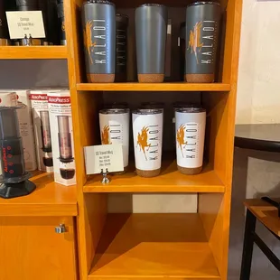 a shelf of coffee roasters