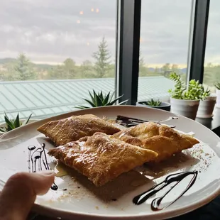 a person holding a plate of food