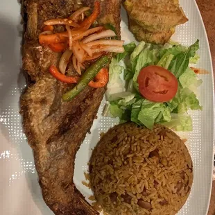 This is fried red snapper with rice n&apos; beans and bannann