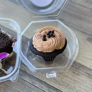 a chocolate cupcake and a piece of cake