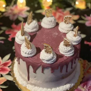 Lemon lilikoi (passion fruit) cake with a ruby chocolate drip