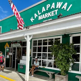 people walking in front of the store