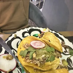 Chicken taco with brown guacamole
