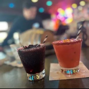 two cocktails on a table