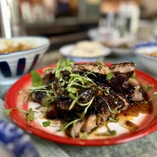 Moo Yaang Prik (grilled mangalitsa pork chop with tamarind, palm sugar and coriander glaze)