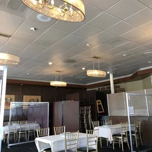 a banquet room with tables and chairs