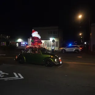 Santa Claus inflatable decor inside of a car *11/29/24