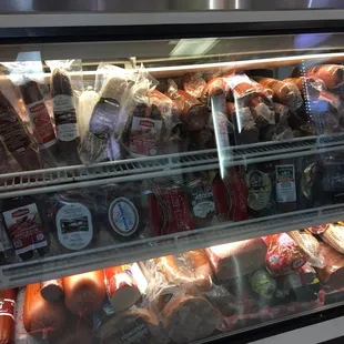 a deli case full of sausages