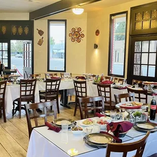 a dining room with tables and chairs