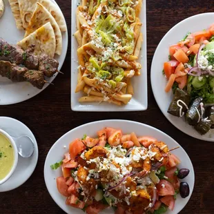 Lamb Souvlaki Plate, Kalita Fries, Veggie Dolma Plate, Prawn Salad,  Avgalemono Soup (chicken, rice, and lemon)