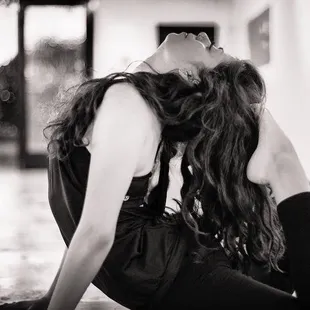 a woman doing a yoga pose